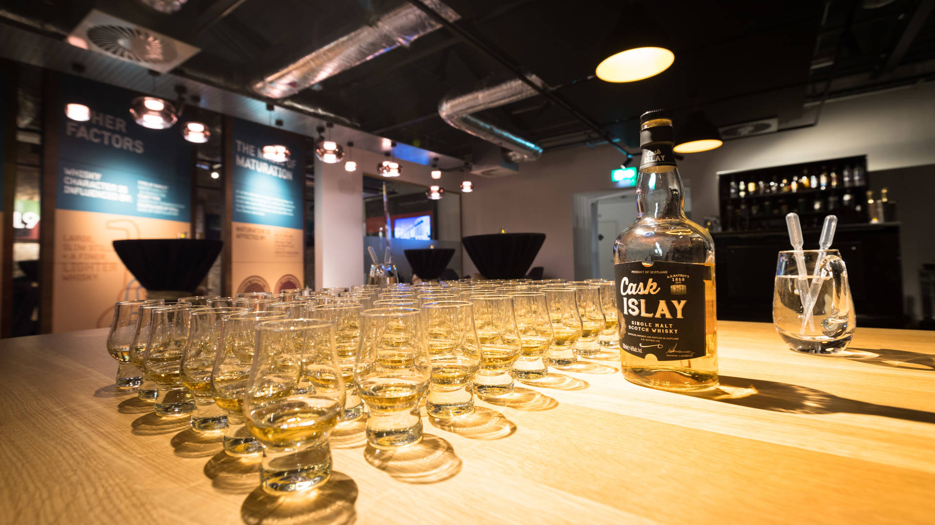 Pre-poured Clydeside dram glasses of Cask Islay for whisky tasting set up. 