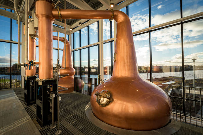 Two Clydeside Copper Stills with blue sky background