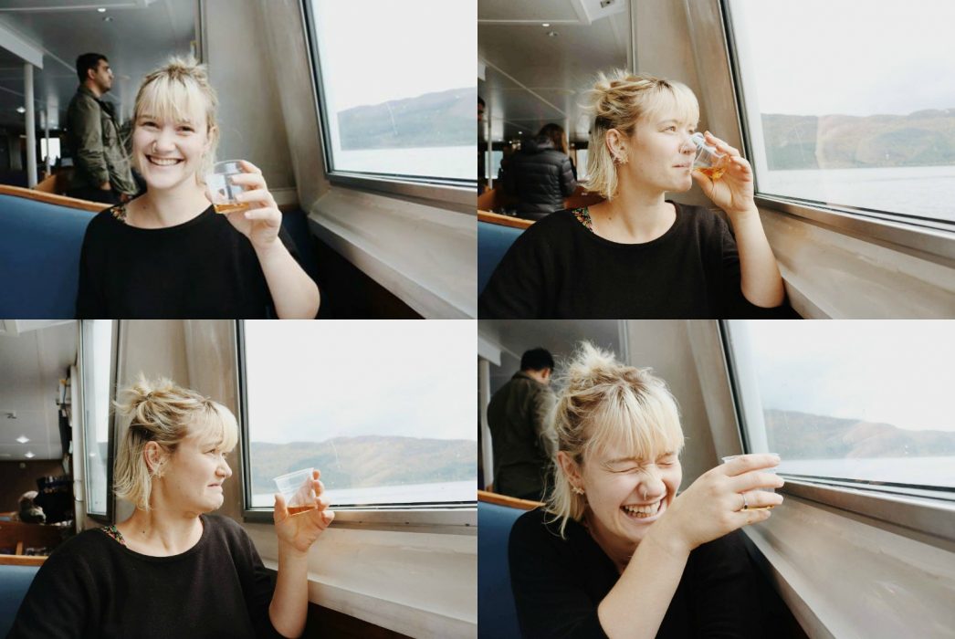 a woman tasting whisky 