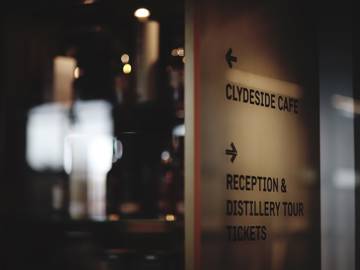 Directional signage to sign post Clydeside Café and Reception