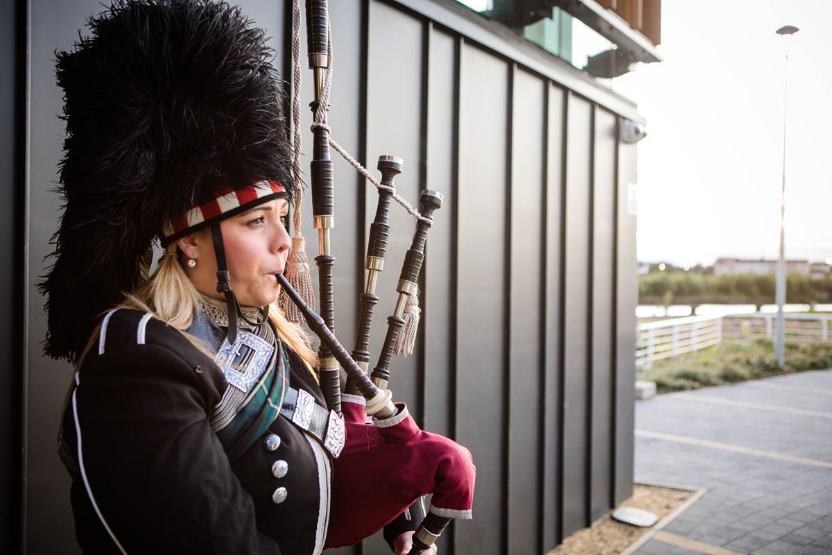 Scottish piper outside main entrance at The Clydeside Distillery